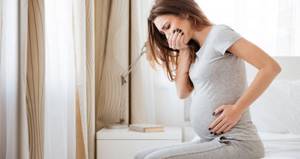Почему болит живот при беременности и как снять боль